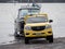 Yellow Mazda BT-50 Generation II (2011-2015) pickup truck pulling Fyran trailer boat