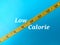 Yellow measuring tape with the word Low Calorie