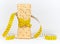 A yellow measuring tape wrapping wheat cracker or crispbread