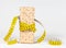 A yellow measuring tape wrapping wheat cracker or crispbread