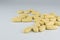 Yellow medicinal pills on isolate background closeup