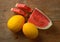 Yellow melon and red watermelon on wooden table - sicilian fruit