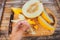 Yellow melon slices with shape heart in female hand