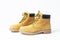 Yellow men`s work boots from natural nubuck leather isolated on white background. Trendy casual shoes, youth style. Concept of
