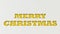 Yellow Merry Christmas words cut in white paper