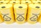 Yellow metal barrels with black biohazard warning sign on white background