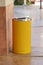 Yellow metal cylinder bin