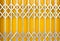 Yellow metal grille sliding door