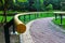 Yellow metal handrail on the exercise walkway for the elderly person