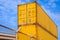 Yellow metal Industrial cargo containers are stacked