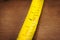 Yellow metallic measuring tape. Macro close up