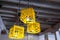 Yellow milk crates used as lampshades in a fashionable cafe