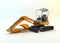 Yellow mini excavator isolated