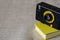 Yellow mini-notepad and a small film retro camera.