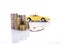 Yellow miniature car on a pile of stack coin