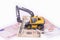 Yellow miniature excavator. rental of construction equipment