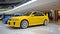 Yellow Mitsubishi Lancer evolution V in a car show