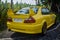 Yellow Mitsubishi Lancer Evolution V in JDM run car meet