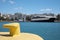 Yellow mooring hook in sea port on sunny day