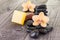 Yellow Moth orchids and black stones on wooden background