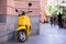 Yellow  motor bike in street