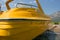 Yellow motor boat on the beach.