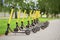 Yellow motorized scooters arranged in a row