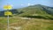 Yellow mountain path indications in Montenegro.