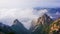 Yellow mountains in the fog at dawn of the sun. Huangshan National Park