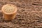 Yellow mustard grains - Sinapis alba. Wooden background