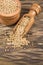 Yellow mustard grains - Sinapis alba. Wooden background