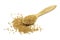 Yellow mustard grains in a wooden spoon