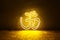 Yellow neon sign OM. Om symbol glow background. Hindu religion. Trendy style