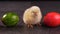 Yellow newborn chicken sitting in colorful dyed easter eggs row