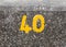 A yellow numbering with paint on sea front wall Harwich 40