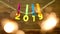 Yellow numbers 2019 hanging on a clothespin on a rope on a wooden background, close-up, New Year 2019, Christmas, they