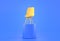 Yellow office chair stand on high blue podium. We are hiring banner, concept of search and recruiting employees