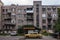 Yellow old car in front constructivist building