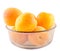 Yellow-orange apricots, in a brown transparent bowl