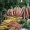 The Yellow and orange bunches of carrots on the farm market