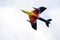 Yellow, Orange, Red and Blue Fighter Aircraft flying Upwards