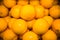 Yellow oranges in bulk. Fruits, citrus fruits