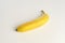Yellow organic tasty banana on white background