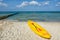 Yellow paddle boat at a sandy beach of the baltic sea