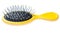 Yellow paddle brush is on white background, side view