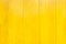 Yellow paint wood wall texture background.vivid color for summer backdrop