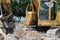 A yellow painted excavator at a construction site