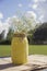 Yellow Painted Mason Jar with Baby`s Breath Flowers at Wedding