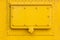 Yellow painted metal plate texture with hatch and rivets