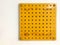 Yellow panel with dot pattern